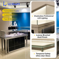 Vitrine de présentation de bijoux de luxe en acier inoxydable, design personnalisé, comptoir de présentation de bijoux noir et or avec éclairage LED verrouillable