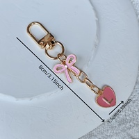 Porte-clés personnalisé en alliage rose avec nœud et lettre en forme de cœur – Accessoire de sac durable et élégant au design mignon