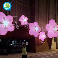 Grandes roses gonflables lumineuses de conception personnalisée pour des activités en plein air annonçant le modèle d'air avec la décoration florale