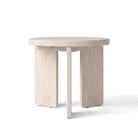Table basse ronde minimaliste moderne en chêne massif avec trois pieds en bois pour salon
