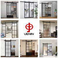 Porte de grange moderne en verre dépoli à prix d'usine avec cadre en aluminium fini, ouverture manuelle pour appartement et chambre à coucher
