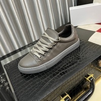Chaussures de sport basses pour hommes Paris Trendy, style décontracté et professionnel, en cuir plissé noir, blanc, rouge, classiques pour Martin