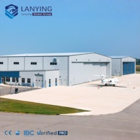 Hangar en structure acier préfabriquée de qualité supérieure avec fenêtres en alliage d'aluminium et porte roulante pour le stockage d'avions privés