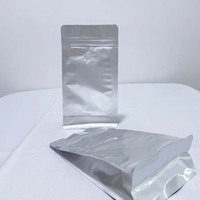 Sac de café en feuille d'aluminium argentée imprimée personnalisée avec valve respirante unidirectionnelle conception réutilisable sac vertical à fermeture éclair papillon