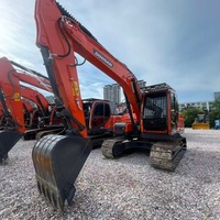 Excavadora de cadenas usada Doosan DX140LCA de alto rendimiento y bajo costo con tren de rodaje estable para proyectos de construcción en carreteras y limpieza de terrenos