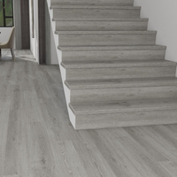 Profilé de marche d'escalier moderne en SPC/WPC, résistant à l'eau, écologique, avec nez de marche assorti pour la décoration de villas et d'appartements