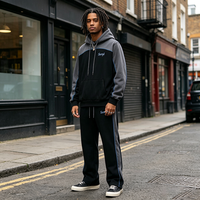Ensemble streetwear unisexe coupe-vent respirant grande taille avec sweat à capuche color block et pantalon de survêtement évasé oversize 2 pièces