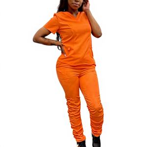 Vente en gros d'uniformes hospitaliers pour infirmières : Ensembles de blouses à manches courtes à volants et pantalons jogger empilés en polyester tricoté - Product Image 1