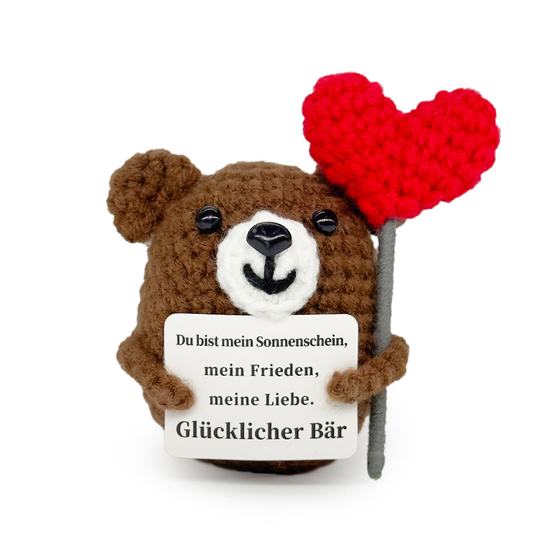 Un petit ours embrasse un cœur