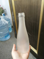 OSHOW Gros 330ml Dépoli En Forme De Goutte de Fruits Jus De Vin Vodka Evian Bouteille En Verre Avec Bouchon À Vis