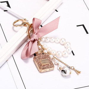 <strong>Mini</strong> <strong>Pink</strong> Bow Keychain <strong>Set</strong> with <strong>Perfume</strong> Style Pendant Luxury <strong>Perfume</strong> Bottle Shaped Pearl Keychain Car Accessories for Women - Product Image 3