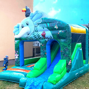 Castillo inflable comercial con tobogán para niños, tipo jungla, ideal para fiestas. - Product Image 1