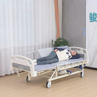 Lit médical manuel à double manivelle avec tête et pied de lit en plastique ABS, barrières latérales semi-pliables et frein de roulettes pour soins aux patients à domicile