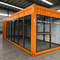 Maisonnette Apple en acier ondulé orange, conteneur habitable avec mur entièrement vitré, double porte, mobilée pour bureau et espace de vie