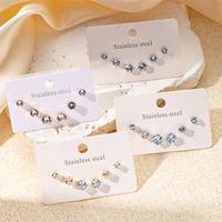 Pendientes de tuerca de acero inoxidable con circonitas engastadas en forma de garra, juego de pendientes pequeños, juego de tres piezas de pendientes de tuerca redondos con circonitas.