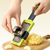 Accessoires de cuisine : Nouveau hachoir à ail manuel multifonctionnel 2025 – Presse-ail et râpe