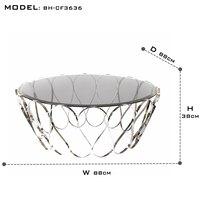 Table basse Aquarius avec plateau en verre fumé et base en acier inoxydable poli, design moderne élégant pour salon