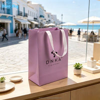 Sacs en papier personnalisés OEM/ODM de luxe, couleur violette, avec poignée intégrée, pour le shopping, la vente en gros de bijoux, de cosmétiques, de vêtements et de cadeaux