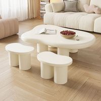 Table basse nuage nordique moderne minimaliste avec plateau en marbre de forme irrégulière, luxe léger pour petit appartement et salon