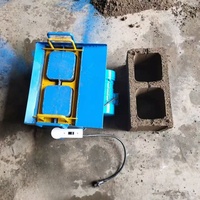 Ligne de production de briques non cuites manuelles électriques simples Machine à haut rendement opération facile moule de bloc de béton à emboîtement creux