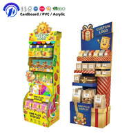 Présentoir de sol robuste à 4 niveaux pour la promotion de snacks, idéal pour les supermarchés et les expositions