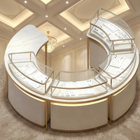 Vitrine d'îlot pour bijoux, ronde et incurvée, avec cadre doré champagne et éclairage LED, pour magasin de diamants