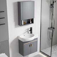 Meuble-lavabo mural étroit en aluminium pour petits espaces, avec vasque ovale, miroir et unité de rangement pour salle de bain ou toilettes.