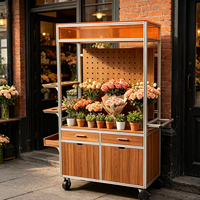Chariot de présentation mobile pour fleuriste en profilé aluminium avec panneau perforé, tiroir et roulettes