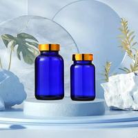 Vente en gros de 75ml 100ml 120ml 150ml 200ml 250ml 300ml 400ml 500ml Capsule pharmaceutique en verre bleu avec bouchon à vis