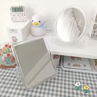 Vente en gros Miroir de courtoisie et de maquillage en acrylique transparent double face Support de bureau rotatif carré et HD Miroir cosmétique personnalisé