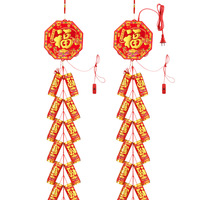 Décoration du Nouvel An chinois, pétards rouges avec pompon rouge et nœud décoratif