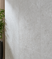 Dalle de porcelaine grand format effet pierre marbre gris contemporain pour la décoration de salons et de halls commerciaux
