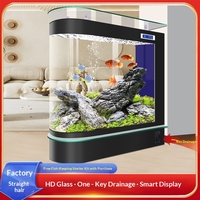 Aquarium cylindrique de luxe moderne en verre pour poissons d'eau douce, avec filtration intelligente et circulation d'eau, idéal pour salon ou bar à domicile