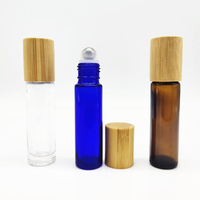 Flacon en verre à bille de 5 ml et 10 ml, transparent, ambré ou bleu, avec couvercle en bambou, pour huile essentielle, massage, huile corporelle