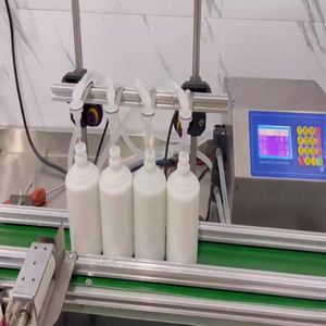 Machine de remplissage automatique quantitative à 4 têtes avec convoyeur pour boissons et jus - Product Image 4