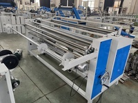 Machine à rouler et à rembobiner les tissus non tissés