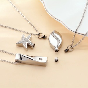 Collier commémoratif en acier inoxydable avec pendentif urne torsadé en forme d'étoile et de goutte d'eau, orné de strass, pour cendres funéraires - Product Image 3