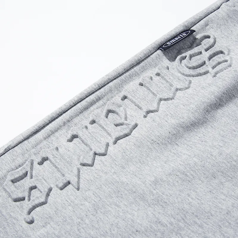 Pantalones cortos para hombre de algodón 2024 con logotipo grabado en relieve en stock de verano baratos al por mayor Unisex 100%