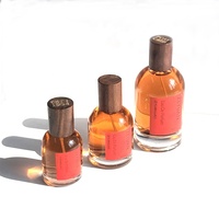 Fabricante de botellas de perfume vacías 30ml 50ml 100mL Cilindro de fragancia Botellas de vidrio redondas con tapa de madera