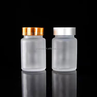 En stock 60ml 100ml 200ml 60cc 100cc 200cc bouteille de capsule de supplément de pilule en verre dépoli transparent avec couvercle en aluminium joint de sécurité