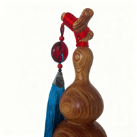 Sculpture artisanale en bois de calebasse symbolisant la chance, l'harmonie et la prospérité pour une décoration élégante de la maison et du bureau
