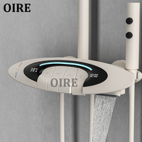 Oire UFO Design White Piano Key 4 Fonctions Ensemble de douche Salle de bain Système de mélangeur de douche à effet pluie chaude et froide de luxe