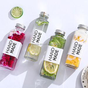 Vente en gros Cmugr1 litre bouteille en verre 12oz 14oz 16oz bouteille de jus boisson carré clair bouchon à vis bouteilles en plastique pour jus BAIDE - Product Image 1