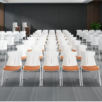 Chaise de formation empilable en plastique avec dossier et coussin en tissu, chaise de visiteur de bureau ergonomique avec cadre blanc et assise rembourrée en tissu orange