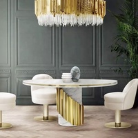 Ensemble de tables rondes de salle à manger de luxe léger avec plateau en marbre naturel et pieds en acier inoxydable, 6 chaises