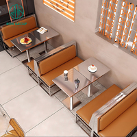 Nouveauté Ensemble table et chaises moderne en acier inoxydable en cuir acrylique pour café commercial et restaurant Meuble de cabine