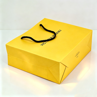 Fournisseur de sacs en papier jaunes pour cosmétiques, emballages cadeaux, mode, maquillage, parfums, design boutique de luxe, sur mesure