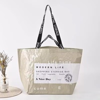 Sac de voyage pliable en polypropylène tissé sur mesure, style minimaliste moderne, grande capacité, imperméable, résistant à l'humidité, avec fermeture éclair