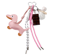 Porte-clés de luxe 2025 pour l'amour, nœud, en cuir PU et alliage de zinc, petit pendentif décoratif pour sac, breloques pour couples