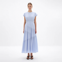 Nouvelle Robe Midi Femme Bleu Clair à Col Rond Manches Courtes Taille Smockée Plissée Asymétrique à Volants Personnalisée Vente en Gros